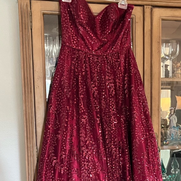 Beautiful strapless burgundy embellished gown. - Picture 2 of 6